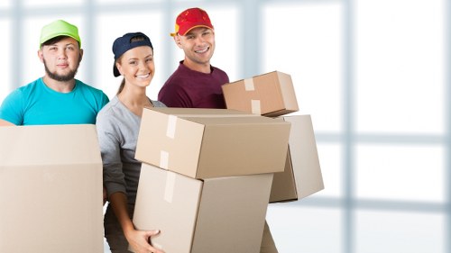 Professional movers handling furniture
