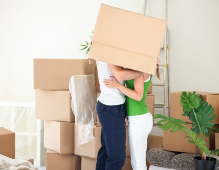 Professional commercial movers assisting with storage